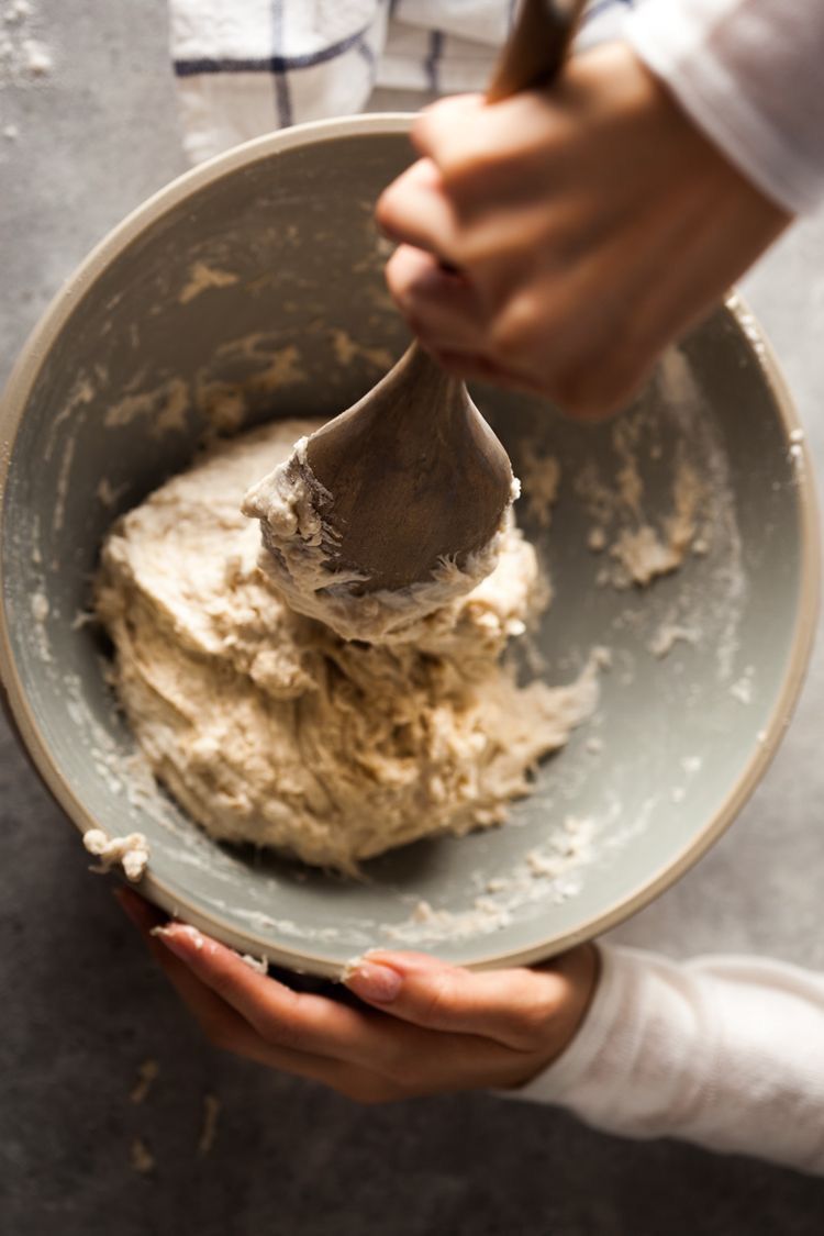 Hands mixing Moroccan dough
